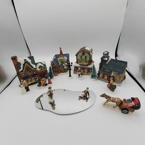 LTD International 16 Piece Lighted Christmas Village W/ Ice Skating Rink